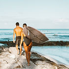Surfers on an alien ocean planet with multiple moons